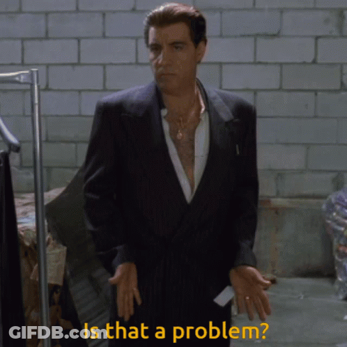 A Man In A Suit With The Words Is That A Problem Behind Him GIF