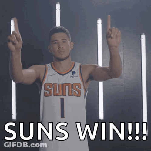A Man In A Suns Jersey Holds Up His Fingers And Says Suns Win GIF