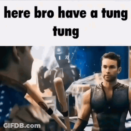 A Man In A Superhero Costume Holds A Baseball Bat And Says Here Bro Have A Tung Tung . GIF