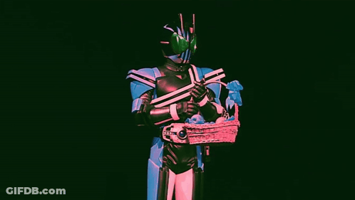 A Man In A Superhero Costume Is Holding A Basket Of Candy . GIF