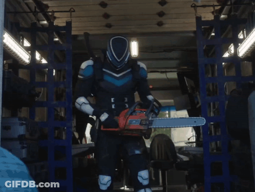 A Man In A Superhero Costume Is Holding A Chainsaw In His Hand GIF