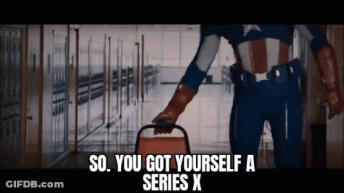 A Man In A Superhero Costume Is Holding A Chair And Says So You Got Yourself A Series X GIF