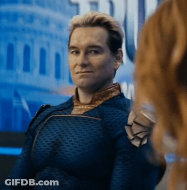 A Man In A Superhero Costume Is Looking At A Woman . GIF
