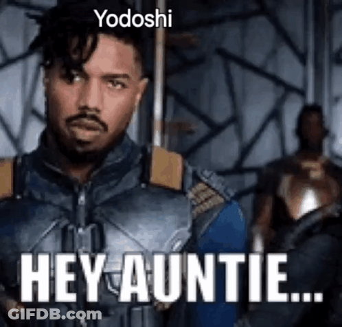 A Man In A Superhero Costume Is Saying `` Hey Auntie '' While Holding A Sword . GIF