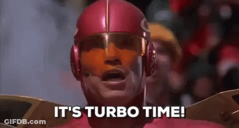 A Man In A Superhero Costume Is Saying `` It 'S Turbo Time ! '' GIF