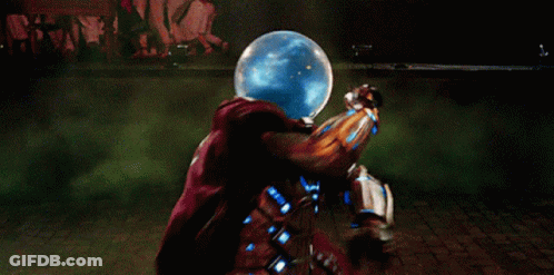 A Man In A Superhero Costume Is Standing In Front Of A Green Glowing Sphere . GIF