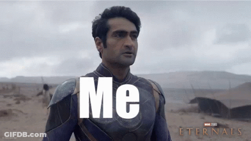 A Man In A Superhero Costume Is Standing In The Desert And Says Me GIF