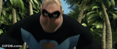 A Man In A Superhero Costume Is Standing In The Jungle GIF