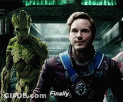 A Man In A Superhero Costume Is Standing Next To A Green Monster And Says Finally . GIF