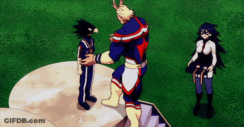 A Man In A Superhero Costume Is Standing On A Podium With Two Other People GIF