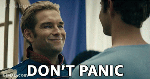 A Man In A Superhero Costume Says " Don T Panic " GIF