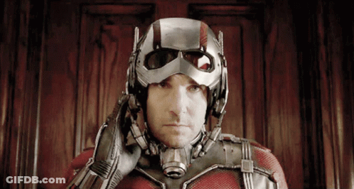 Man In Superhero Costume With Helmet On GIF