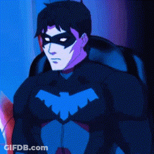 A Man In A Superhero Costume With A Mask On His Face . GIF