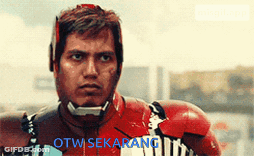 A Man In A Superhero Costume With The Words Otw Sekarang On The Bottom GIF