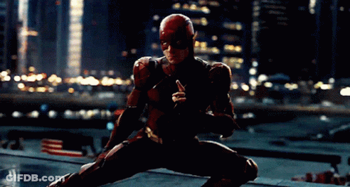 A Man In A Superhero Suit Is Kneeling Down GIF