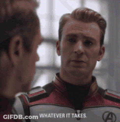 A Man In A Superhero Suit Is Talking To Another Man In A Room . GIF