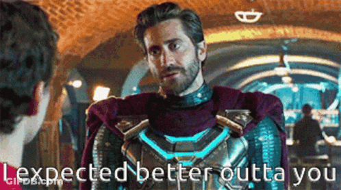 A Man In A Superhero Suit Is Talking To Another Man In A Tunnel . GIF