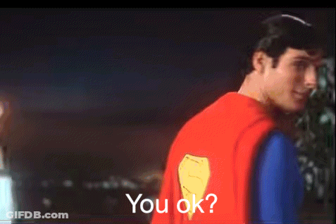 A Man In A Superman Costume Is Asking If You Are Ok GIF