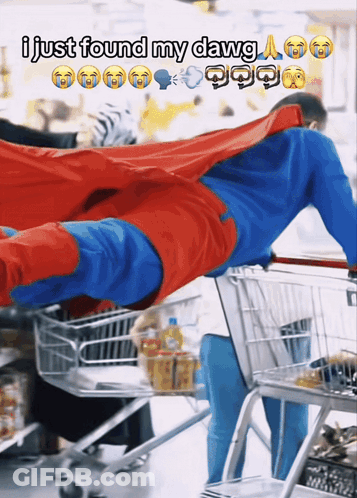 A Man In A Superman Costume Is Pushing A Shopping Cart With A Caption That Says I Just Found My Dawg GIF