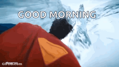 A Man In A Superman Costume Says Good Morning In Front Of A Snowy Mountain GIF