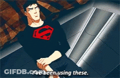 A Man In A Superman Shirt Is Sitting Down And Says I 'Ve Been Using These GIF