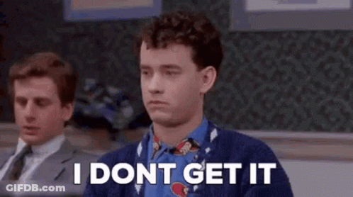 A Man In A Sweater And Tie Is Sitting In Front Of A Chalkboard And Says `` I Dont Get It '' . GIF