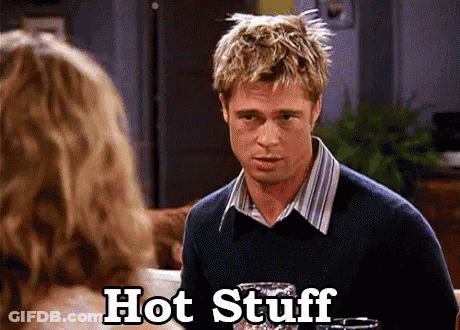 A Man In A Sweater Is Talking To A Woman And The Words Hot Stuff Are Next To Him GIF