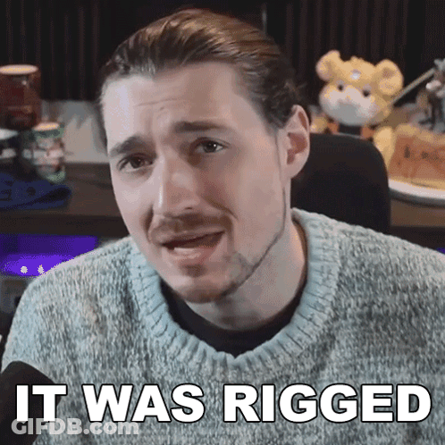 A Man In A Sweater Says It Was Rigged In Front Of A Stuffed Animal GIF