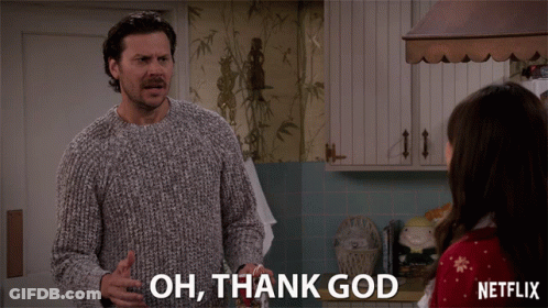A Man In A Sweater Says " Oh Thank God " In Front Of A Woman GIF