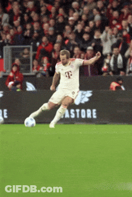 A Man In A T-Mobile Jersey Kicking A Soccer Ball On A Soccer Field GIF