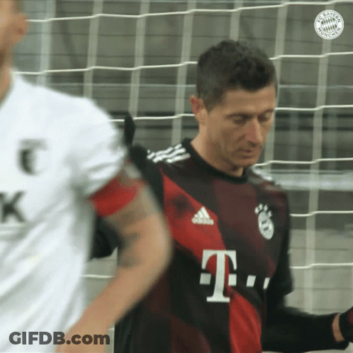 A Man In A T-Mobile Jersey Stands In Front Of A Soccer Net GIF