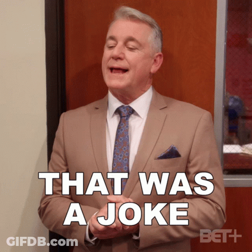 A Man In A Tan Suit And Tie Says That Was A Joke GIF