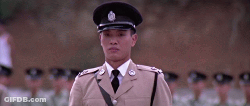 A Man In A Tan Uniform Has A Badge On His Hat That Says ' A ' On It GIF