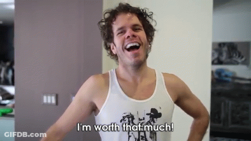 A Man In A Tank Top Is Laughing And Says I 'M Worth That Much GIF