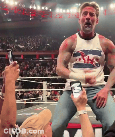 A Man In A Tank Top With A Flag On It GIF