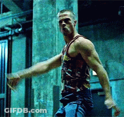 A Man In A Tank Top With A Skull And Crossbones Design On It GIF