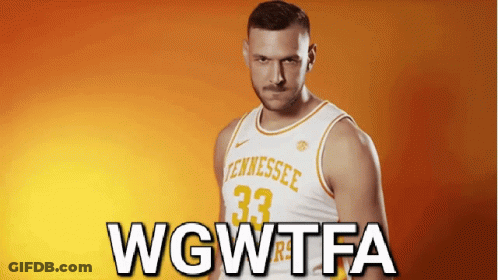 A Man In A Tennessee Jersey Stands In Front Of A Orange Background GIF