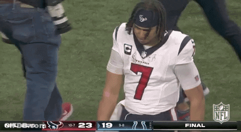 A Man In A Texans Jersey Is Kneeling On The Field GIF