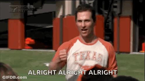 A Man In A Texas Shirt Is Standing On A Field And Says Alright Alright Alright . GIF