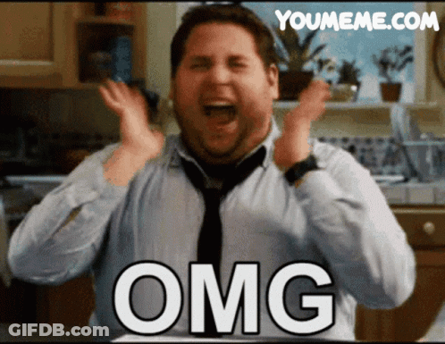 A Man In A Tie Is Making A Funny Face With The Word Omg On His Chest GIF