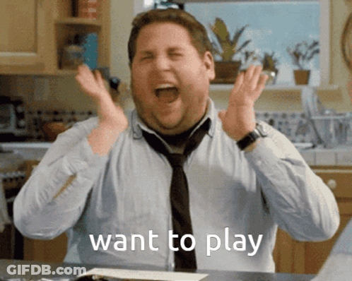 A Man In A Tie Is Making A Funny Face With The Words Want To Play Below Him GIF