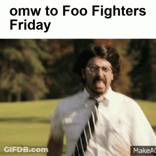 A Man In A Tie Is Running In A Field With The Words Omw To Foo Fighters Friday GIF