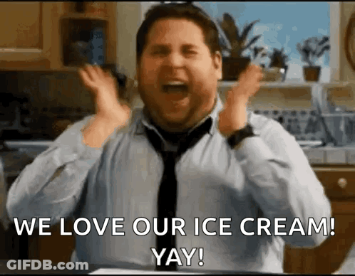 A Man In A Tie Is Screaming With His Hands In The Air While Saying We Love Our Ice Cream ! Yay ! GIF