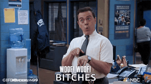 A Man In A Tie Says Woof Woof Bitches In An Office GIF