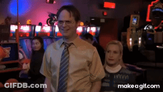 A Man In A Tie Stands Next To A Woman In A Make A Gif.com Image GIF
