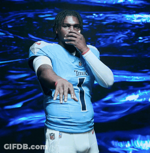 A Man In A Titans Jersey Covering His Mouth GIF