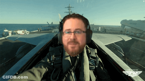 A Man In A Top Gun Maverick Fighter Jet Takes A Selfie GIF
