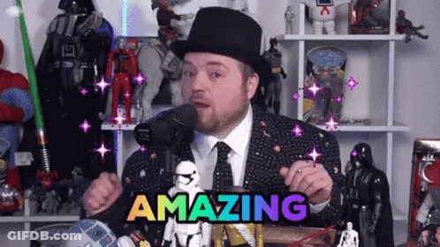 A Man In A Top Hat And Tie Is Holding A Sign That Says Amazing GIF