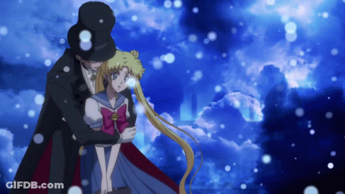 A Man In A Top Hat Is Hugging A Girl In A Sailor Uniform GIF