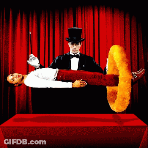 A Man In A Top Hat Is Performing A Trick With A Chicken Ring GIF